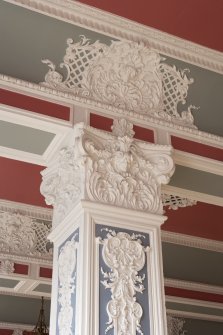 Interior. Ground floor.  Marryat Hall.  Detail of column capital with ceiling decoration above.