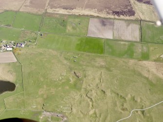 General oblique aerial view centred on the remains of the farmstead, field boundaries and rig at Toranore, taken from the NNW.