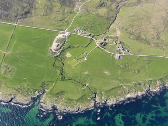 General oblique aerial view of chapel and burial ground at Nereabolls, Islay, taken from the SE.