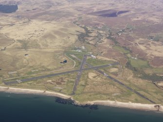 General oblique aerial view of Port Ellen Airfield, taken from the WSW.