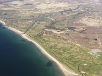 General oblique aerial view of Port Ellen Airport and Machrie Hotel with the golf course adjacent, taken from the SSW.