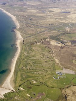 General oblique aerial view of Port Ellen Airport and Machrie Hotel with the golf course adjacent, taken from the S.