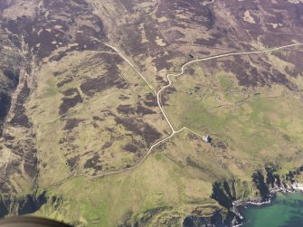 General oblique aerial view of the remains of the farmsteads, field boundaries and rig at Lurabus, Islay, taken from the SE.