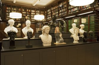 1st floor. Relocated library. Partition with portrait busts.