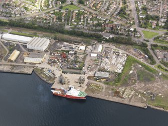 General oblique aerial view of Caledon East Wharf at Stannergate, Dundee, taken from the SSE.