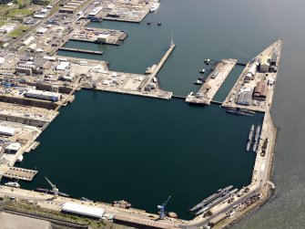Oblique aerial view of HM Dockyard main basin Rosyth, taken from the W.
