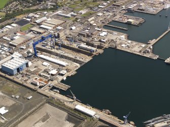 Oblique aerial view of HM Dockyard main basin Rosyth, taken from the WSW.