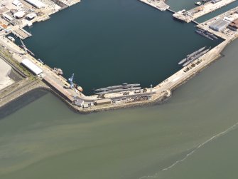 Oblique aerial view of HM Dockyard main basin Rosyth, taken from the SW.