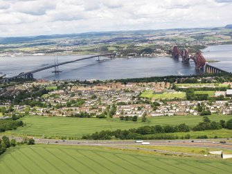 General oblique aerial view of South Queensferry, Forth Rail Bridge and Forth Road Bridge, taken from the NW.