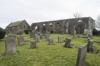 View looking across the burial ground to the N side of the church, taken from the north west