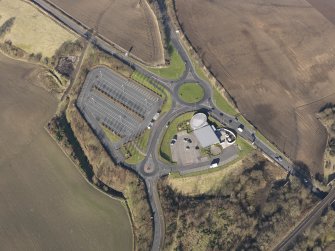 Oblique aerial view of the car parking facilities for the Millennium Wheel visitor centre, taken from the SE.
