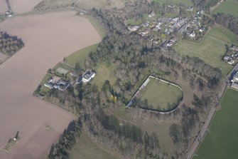 Oblique aerial view of Rossie House and walled garden with Forgandenny village beyond, looking NE.