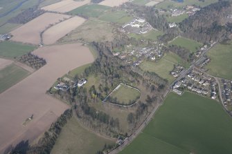 General oblique aerial view of Rossie House and walled garden with Forgandenny village beyond, looking ENE.