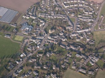 Oblique aerial view of Dunning village, looking NE.