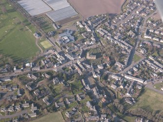Oblique aerial view of Dunning village, looking N.