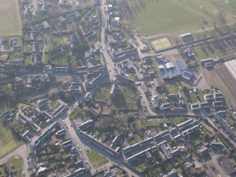 Oblique aerial view of Dunning village, looking W.