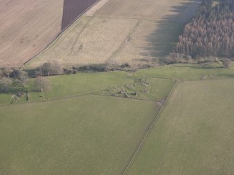 Oblique aerial view of the buildings at Buttergask, looking SSE.