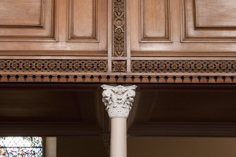 Interior. Detail of column capital and decoration on balcony front