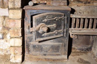 Interior. Detail of range within basement fireplace