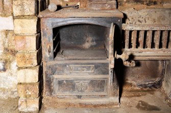 Interior. Detail of range within basement fireplace