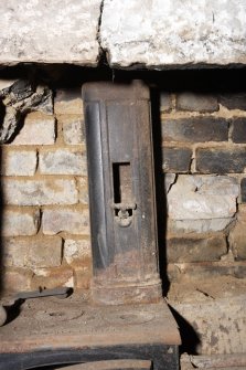 Interior. Detail of range within basement fireplace