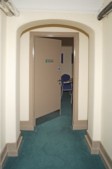 Interior. Basement. Detail of door within recessed arches.