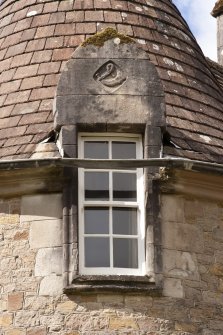 Detail of east dormer window with carved stone pediment at 2nd floor level of south facade, Ardkinglas House.