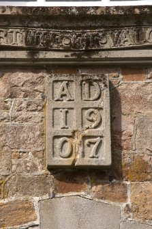 Detail of datestone (1907) above east entrance