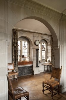 Interior. 1st floor, upper hall, view through arch to corridor beyond