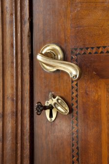 Interior. 1st floor, dining room, detail of door handle and escutcheon