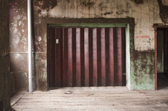 Interior. Spinning mill, 3rd floor, main room, view of lift in south west corner