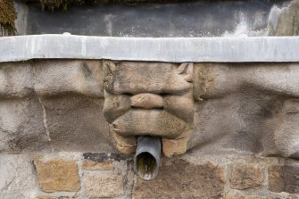 Parapet of tower, detail of carved water spout at east end