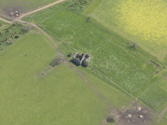 Oblique aerial view of Pittarthie Castle, taken from the NW.