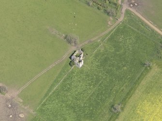 Oblique aerial view of Pittarthie Castle, taken from the SW.