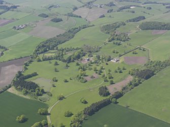 General oblique aerial view of Pitlour House policies centred on the house, taken from the SE.