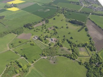 General oblique aerial view of Pitlour House policies centred on the house, taken from the WNW.