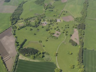 General oblique aerial view of Pitlour House policies centred on the house, taken from the SE.