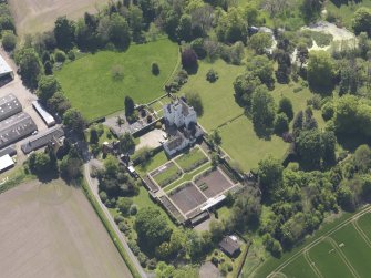 Oblique aerial view of Balmanno Castle, taken from the NNE.