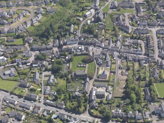 General oblique aerial view of Abernethy centred on the Kirk of St Bride, taken from the NW.