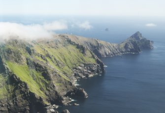 General oblique aerial view of St Kilda, centred on Mullach Bi and the island of Dun, taken from the SW.