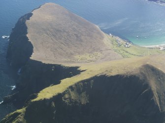 General oblique aerial view of St Kilda, centred on Village Bay and enclosures at An Lag Bho'n Tuath, taken from the NW.