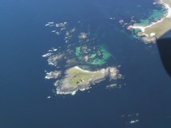 General oblique aerial view of the lighthouse on Siolaigh, Monach Isles, taken from the WSW.