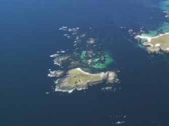 General oblique aerial view of the lighthouse on Siolaigh, Monach Isles, taken from the SW.