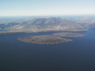 General oblique aerial view of Soay with the Cuillin Hills beyond, taken from the S.