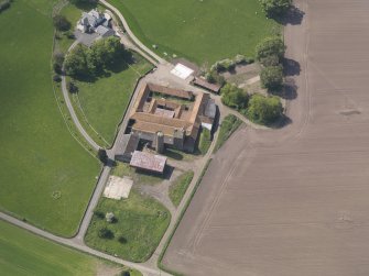 Oblique aerial view of Collairnie Castle and steading, taken from the NE.