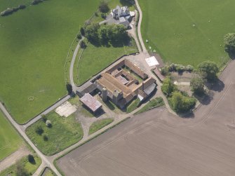 Oblique aerial view of Collairnie Castle and steading, taken from the N.
