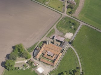 Oblique aerial view of Collairnie Castle and steading, taken from the SSW.