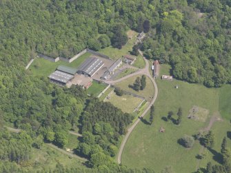 Oblique aerial view of Scotscraig Farm, taken from the SW.