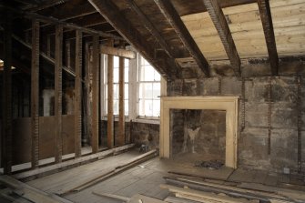 General view in attic showing fireplace.