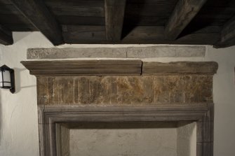 Interior, detail of fireplace lintel, upper ground floor, NE house.